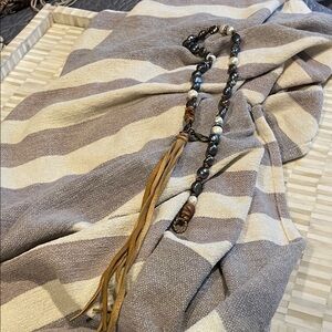 Melody Stallings blue and white pearl necklace with deer hide Tassel